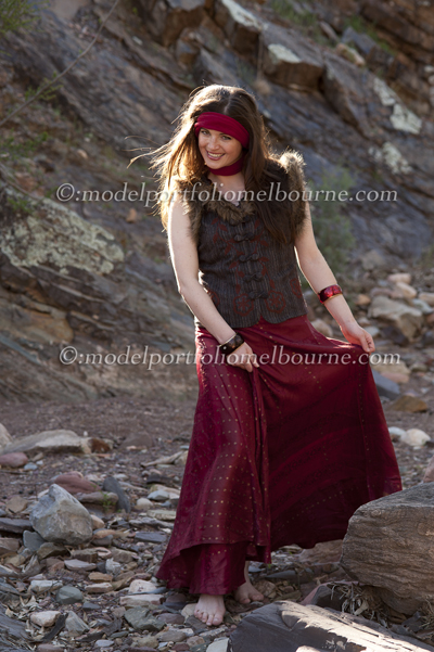 model competition winner, wears hippie clothing in Australian desert